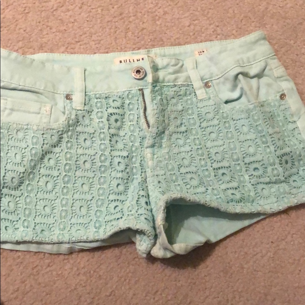 Teal blue shorts.